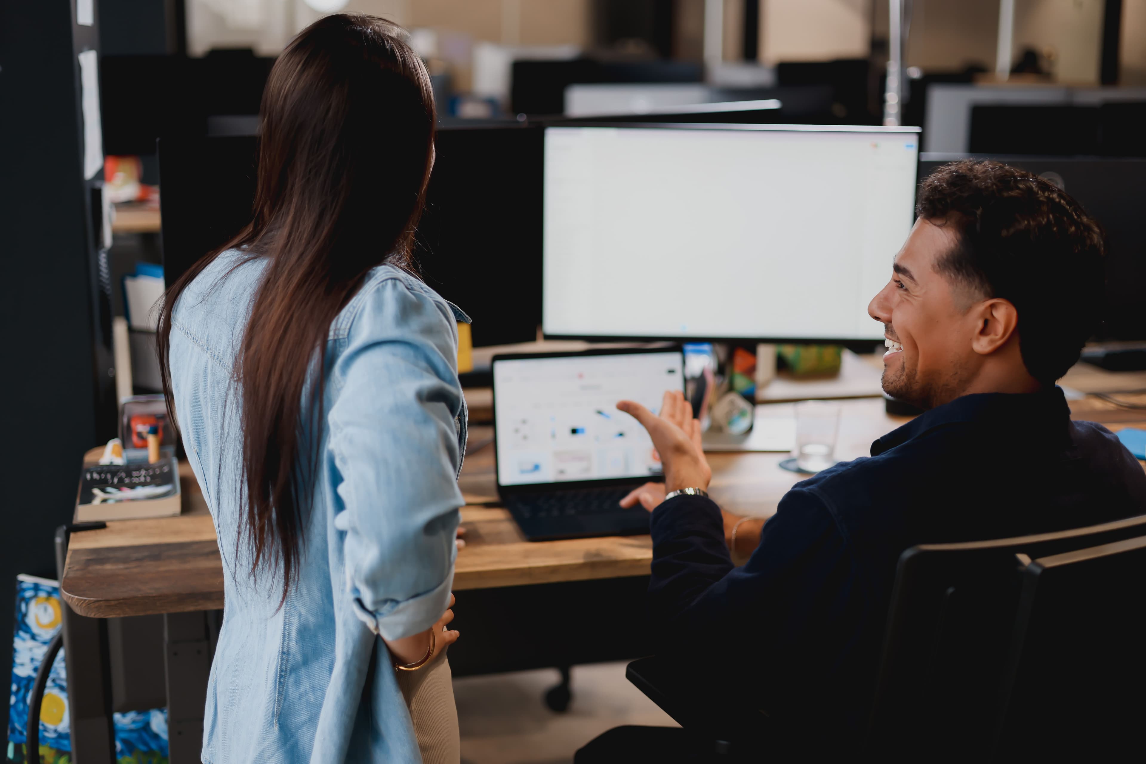 Two team members editing a webpage